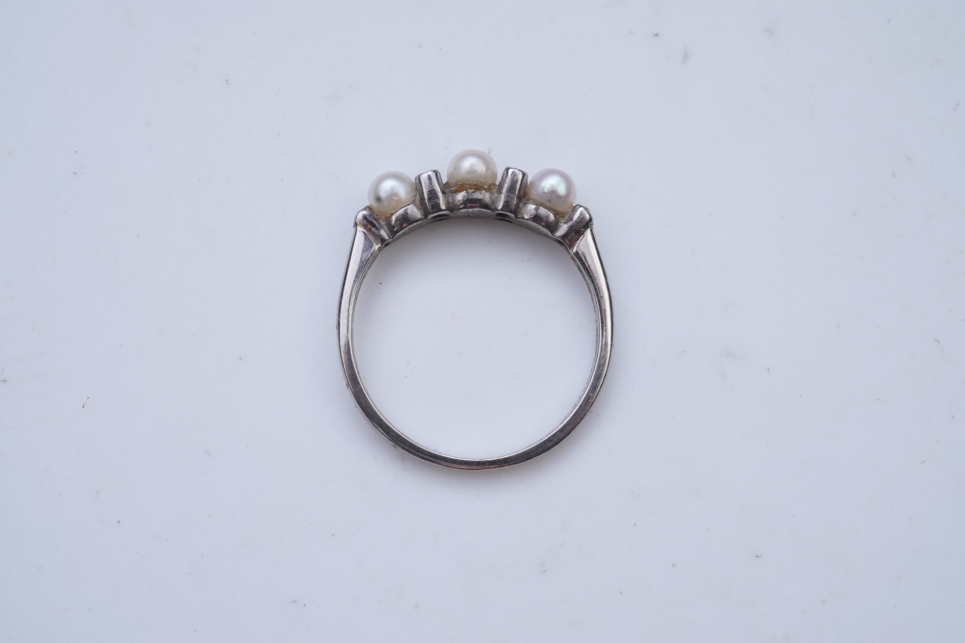 An Edwardian seed pearl brooch and a pearl and diamond ring
